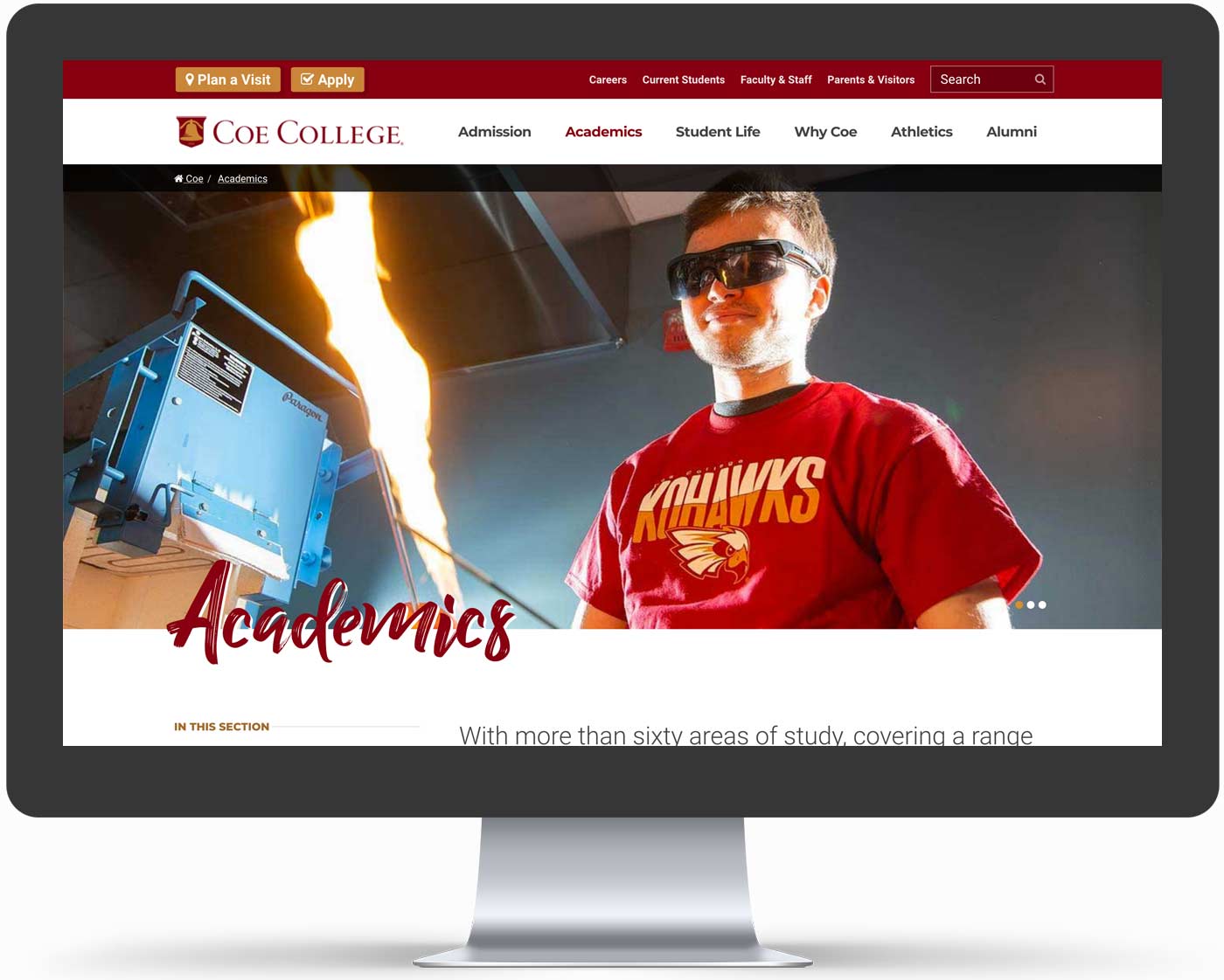 The COE college website is displayed on a large desktop computer