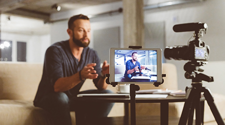 Man sitting in front of mobile video setup