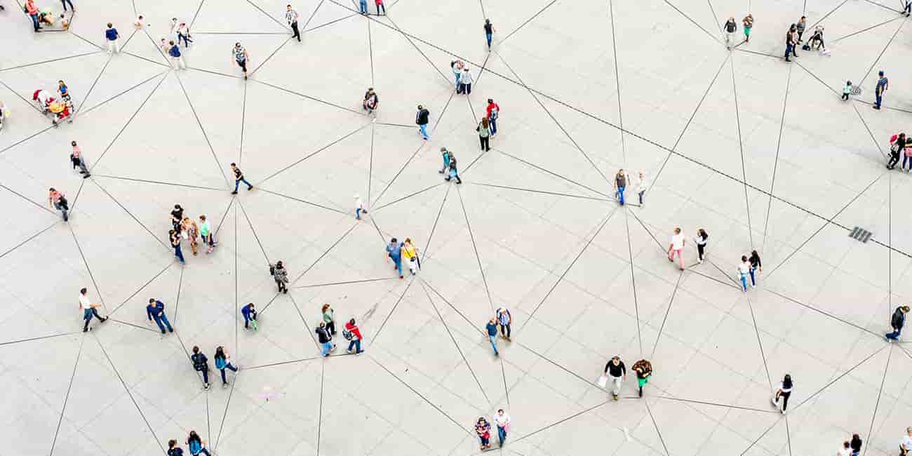 An aerial image of many people walking all connected by various lines