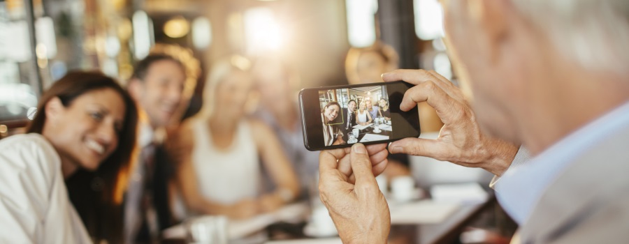 Boss taking picture for social media