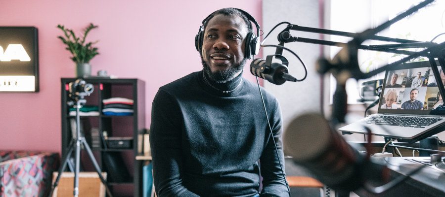 Man recording a podcast ad in a studio