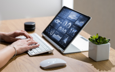 Person typing on laptop while reviewing an analytics dashboard