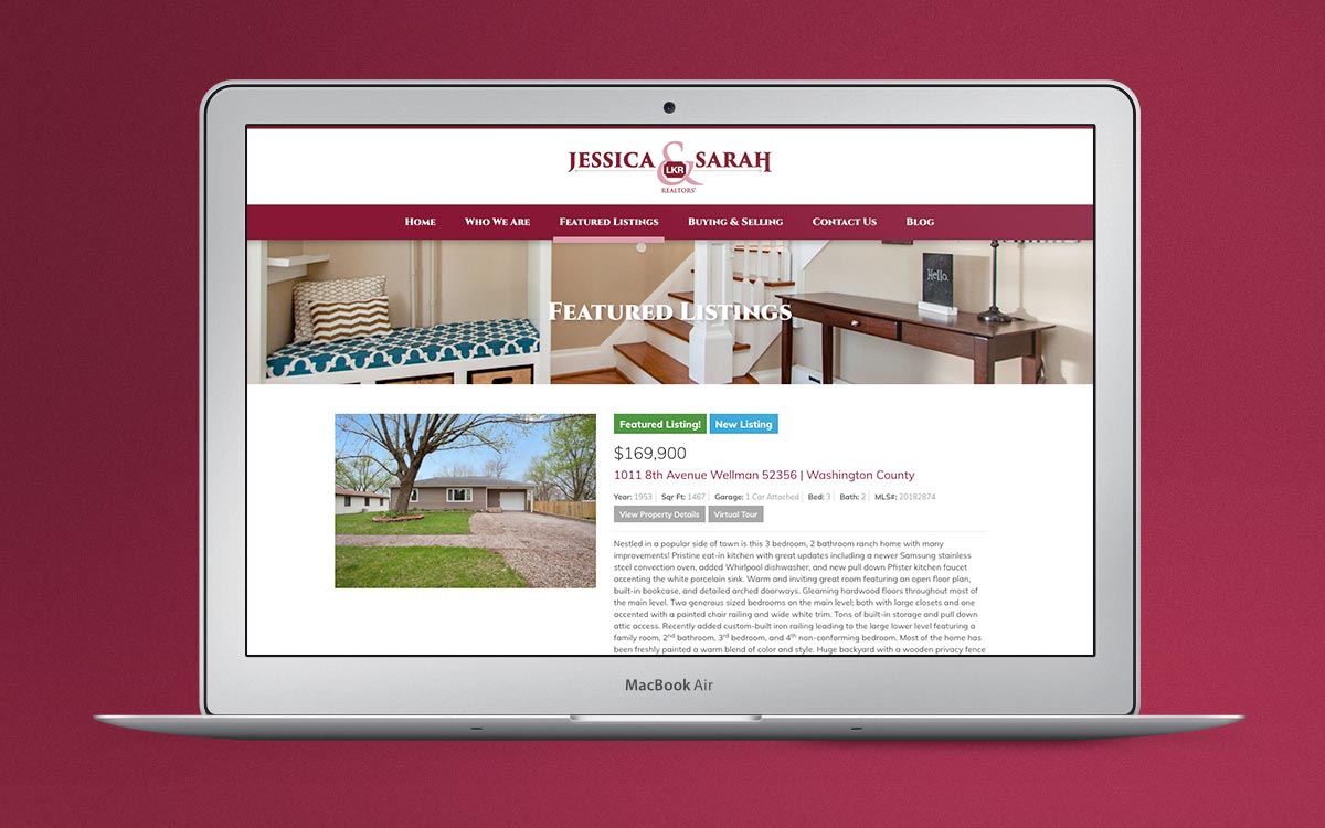 Real estate listings are displayed on a laptop computer