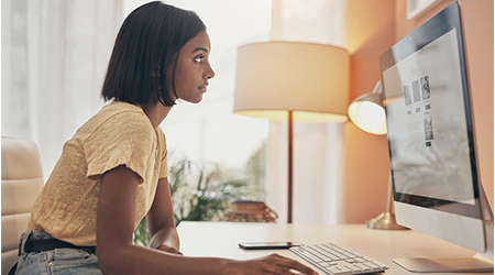 Woman creating a website on her computer