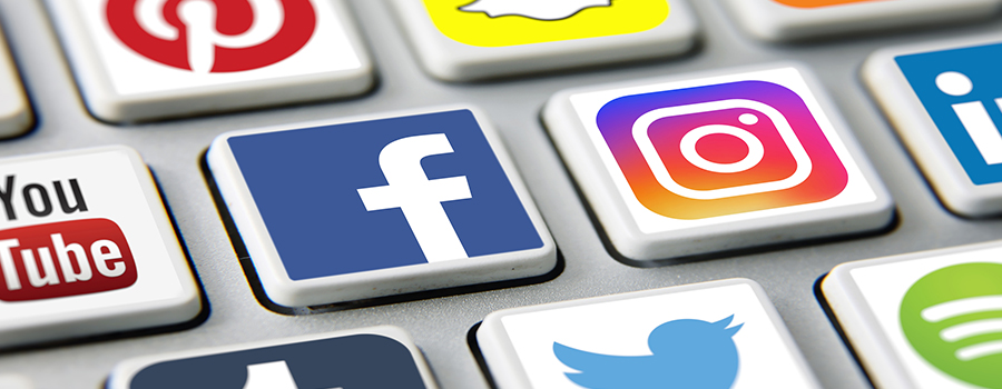 Keyboard keys with social media icons on them