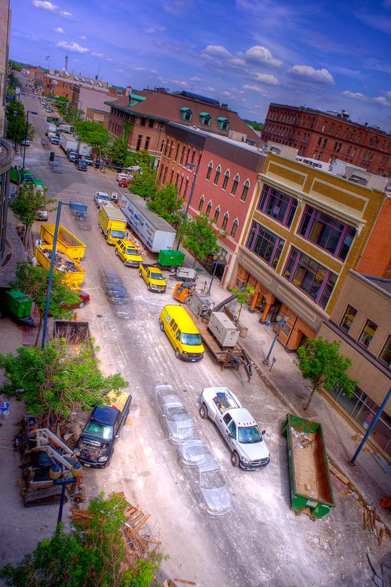 The aftermath of the Cedar Rapids flood with cars and dirty streets