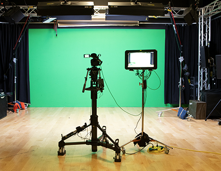A HD camera and lights in the Informatics video studio