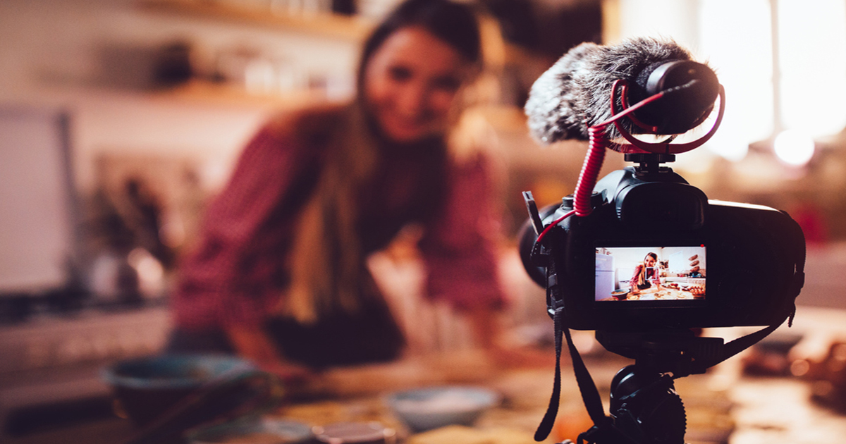 A picture of a woman filming herself